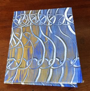 Handmade accordian book of brayer-rolled watercolors